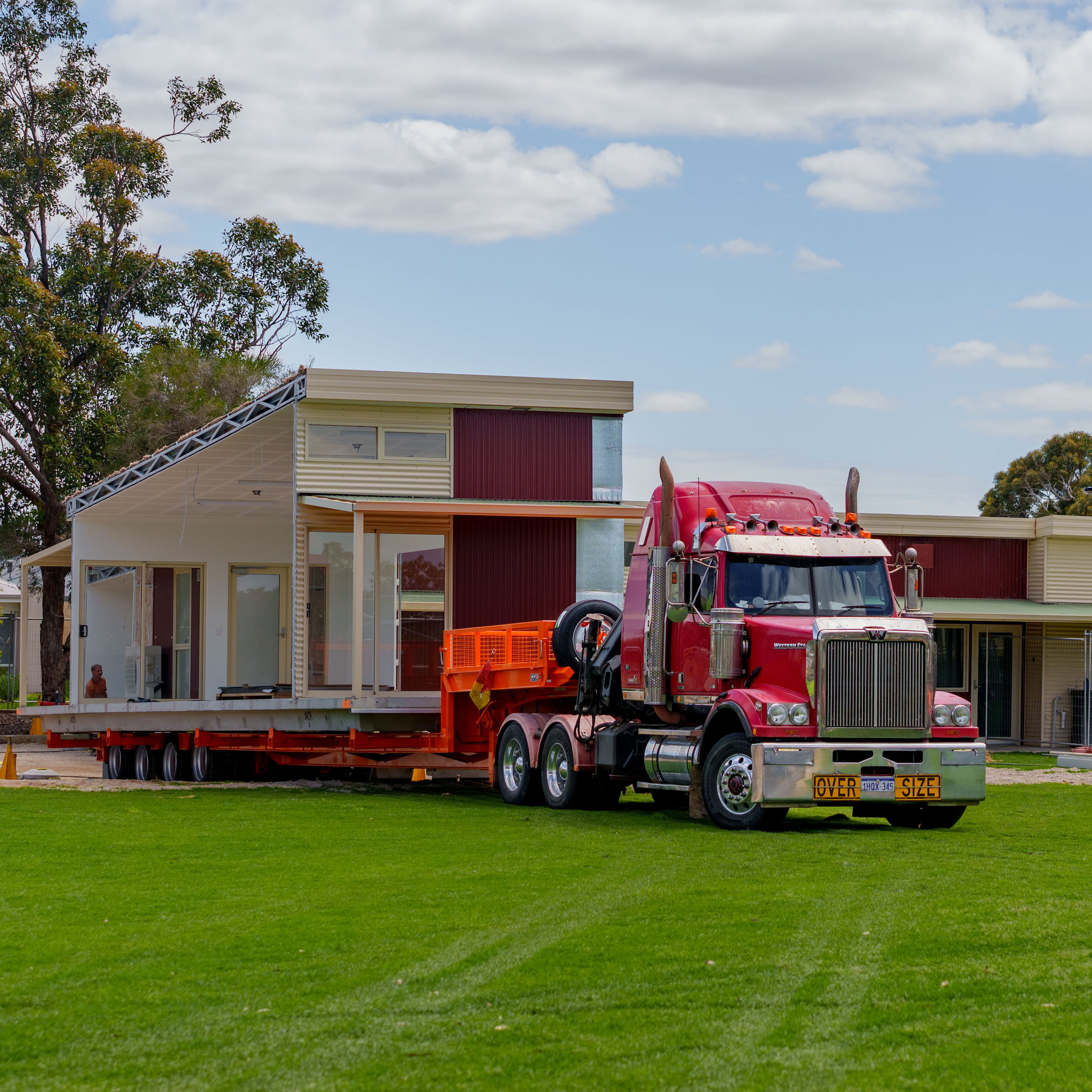 High-capacity crane lifting a prefabricated modular home, exemplifying Rapid Modular WA's fast and reliable modular building assembly across Perth and greater Western Australia.